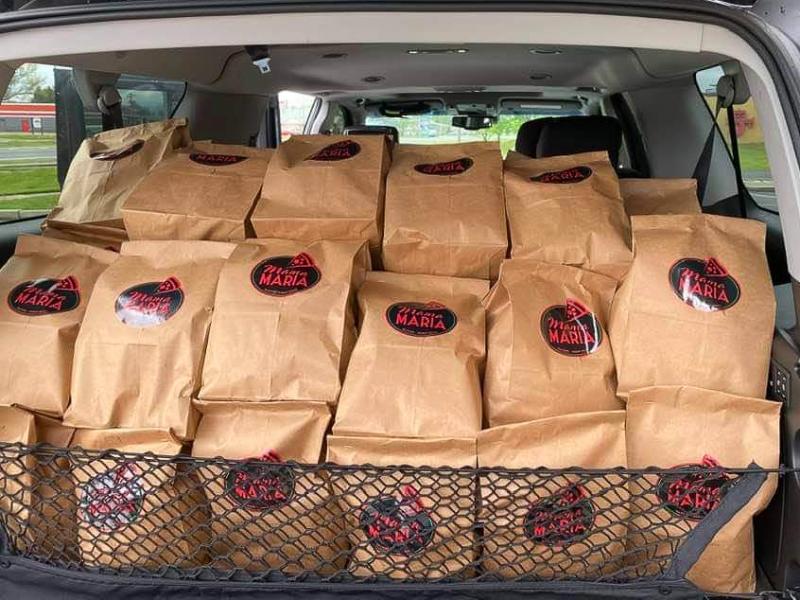 Mama Maria's co-owner Franco loads up several hundred meal kits in Milford to be distributed to anyone who has the need.
SUBMITTED PHOTO